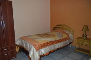 Postel nebo postele na pokoji v ubytování Hostal Coronel Pedro Arraya