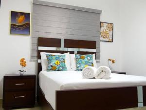 Postel nebo postele na pokoji v ubytování Cipres Deluxe