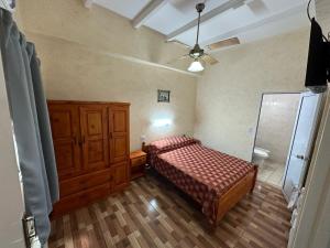 Giường trong phòng chung tại Centro1555