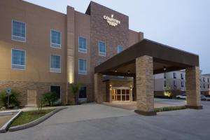 una representación de la parte delantera de un edificio hospitalario en Country Inn & Suites by Radisson, Katy (Houston West), TX en Katy