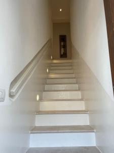 a staircase in a building with white walls at Suite Dolce Vita in Monopoli +72 photos