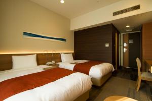 Postel nebo postele na pokoji v ubytování Hotel Sunroute Chiba + 18 fotografií