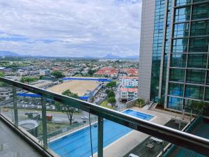 a view of a city from the balcony of a building at Imperial Grand Suite Apartment Kuching in Kuching