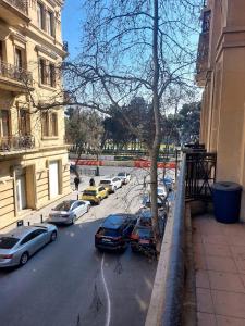 a group of cars parked on a city street at A & F HOSTEL in Baku