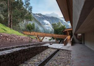 a building with a view of a mountain at Explora Valle Sagrado in Urubamba