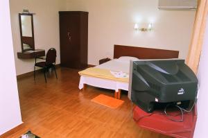 Posteľ alebo postele v izbe v ubytovaní Hotel Srinivas