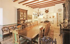 a dining room with a large wooden table and chairs at Stunning Home In Vilanova Del Valls With Outdoor Swimming Pool in Vallromanes
