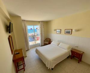 Postel nebo postele na pokoji v ubytování Hotel Cabello