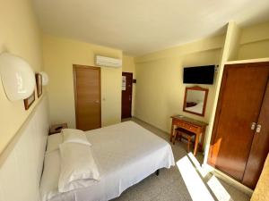 Postel nebo postele na pokoji v ubytování Hotel Cabello