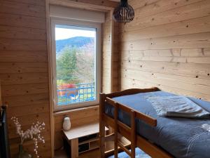 Posteľ alebo postele v izbe v ubytovaní L'apparté de G, Gîte 3 étoiles de montagne cosy