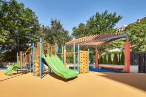 a playground with a slide in a park at Clarendon 1BR w Gym WD Doorman nr Metro WDC-350 in Arlington