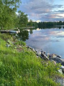 a view of a lake with a boat in the water at Lieblingsplatz in Rörvik