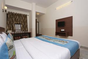 Hotel Maan's Heritage tesisinde bir odada yatak veya yataklar