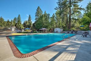 a large swimming pool with blue water at Tuolumne Vacation Rental about 45 Mi to Yosemite in Tuolumne