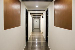 a corridor of a building with a hallway at Collection O World Class Hotel Crescent Near Phoenix Marketcity in Bangalore