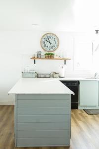 a kitchen with a clock on the wall at Happy Trails BnB in Tropic