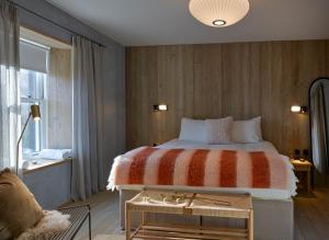a bedroom with a large bed and a window at Ainster House in Fife