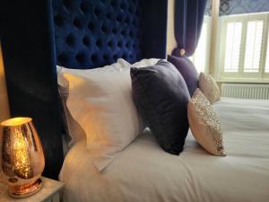 Ένα ή περισσότερα κρεβάτια σε δωμάτιο στο Belle Vue Guest House