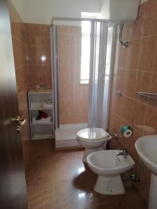 a bathroom with a toilet and a sink at B&B Da Rosa Camerota in Camerota