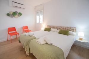 En eller flere senge i et værelse på Apartamento Malibu Cadiz playa