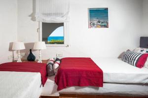 Łóżko lub łóżka w pokoju w obiekcie Villa Bini Sek