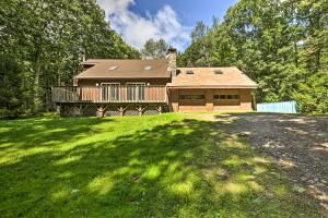 a house with a large yard in front of it at Modern Catskills Escape on 25 Acres with Deck! in Mountain Dale