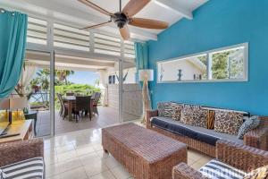 a living room with a couch and a table at Bonaire Oceanfront Apartments in Kralendijk