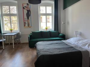 Łóżko lub łóżka w pokoju w obiekcie Narutowicza 5 Apartments