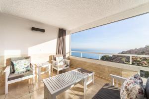 a living room with a view of the ocean at Espejo del Mar in Almería