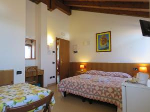 Een bed of bedden in een kamer bij Agriturismo Ca' Marcello
