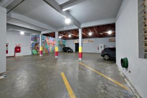 a garage with a parking lot with a car parked in it at HOTEL SENADoR in Ribeirão Preto