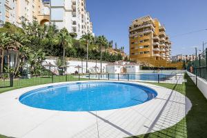 a swimming pool in a city with tall buildings at Hanami Puerto Blanco (PB-23-3IZQ) in Estepona