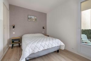 Posteľ alebo postele v izbe v ubytovaní Coquet appartement à 300 m du port du Pouliguen