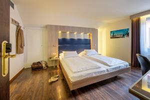 Кровать или кровати в номере Hotel Alexander Zurich Old Town