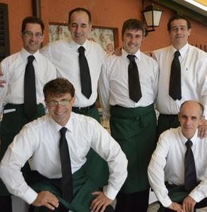 a group of men in ties posing for a picture at Albergo Della Torre in Cernobbio