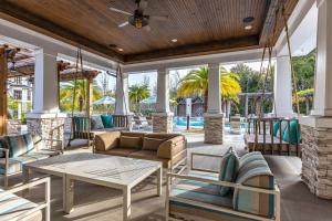 a living room with a couch and a table at Vintage Amelia Island Florida in Fernandina Beach