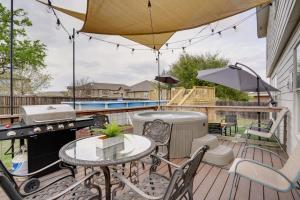 a patio with a grill and a table and chairs at Home with Game Room and Hot Tub, 1 Mi to SeaWorld in San Antonio