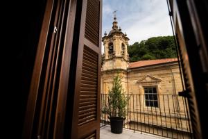 a view of a building with a clock tower at Hotel Atari in San Sebastián