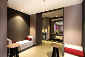 Postel nebo postele na pokoji v ubytování Aston Priority Simatupang Hotel and Conference Center