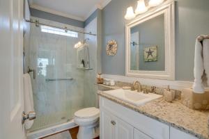 a bathroom with a sink and a shower and a toilet at Fort Myers Home Near Sanibel Island Causeway in Fort Myers +31 photos