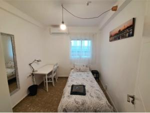 Ένα ή περισσότερα κρεβάτια σε δωμάτιο στο Carmen Guest House