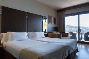 Cama o camas de una habitación en Gran Talaso Hotel Sanxenxo