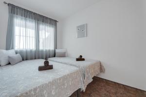 Postel nebo postele na pokoji v ubytování RAXI + 10 fotografií