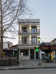 a building on a street with a street light at Plane Tree Luxury Suites in Ioannina