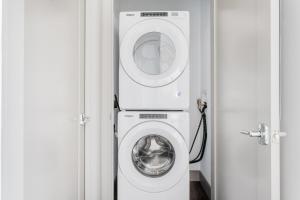 a washer and dryer in a small room at New build Sommerville 2BR w Rooftop WD in unit BOS-364 in Somerville