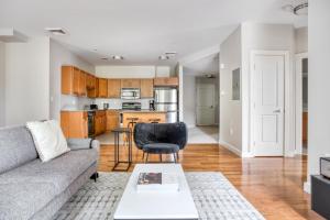 a living room with a couch and a table at Somerville 1br w wd in building nr Harvard MIT BOS-764 in Cambridge