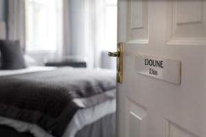 A bed or beds in a room at The Corries B&B 