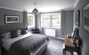 A bed or beds in a room at The Corries B&B 