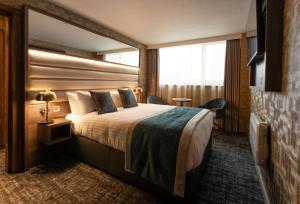 Postel nebo postele na pokoji v ubytování Carlton Hotel + 37 fotografií