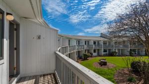 a balcony of a house with a yard at Hidden Beach 219 in Santa Rosa Beach